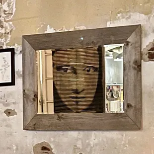 a picture of a woman&apos;s face in a mirror