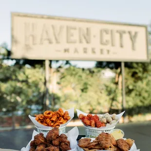 a person holding a tray of food