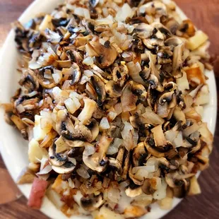 a plate of cooked mushrooms and onions