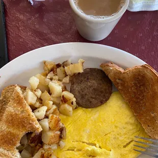 a plate of breakfast food and a cup of coffee