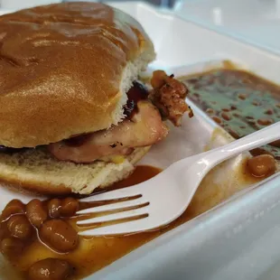 Smoked chicken sandwich and baked beans.
