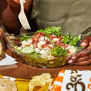 a woman eating a salad