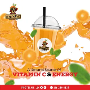 a glass of orange juice with a straw