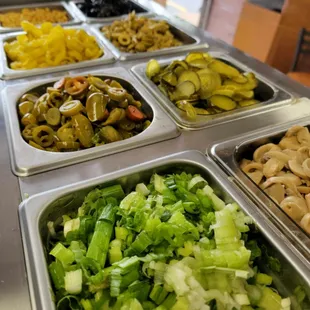 a variety of salads in trays