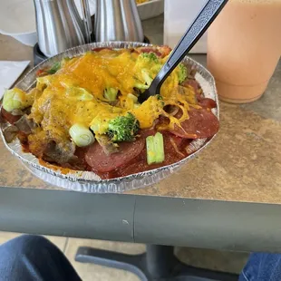 potato pizza, pepp gyro, broccoli &amp; onion. Cheddar on top. Needs to stay in the oven longer I'll blast it at home
