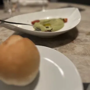 Bread service with in house sourdough bread and pea &amp; artichoke hummus