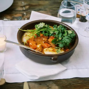 Slow roasted black cod with red chermoula, blistered sungold tomatoes (photo: Annie Hall Photography)