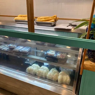 a variety of pastries in a display case