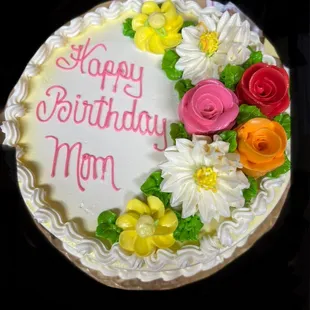a birthday cake with flowers on it