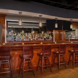a bar with wooden bar stools