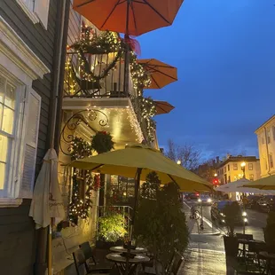 an outdoor patio with umbrellas