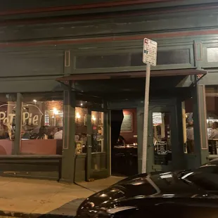 the front of a restaurant at night