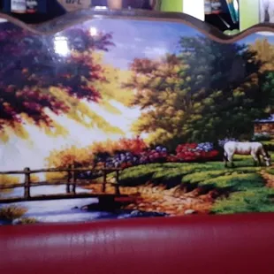 a painting of horses in a pasture