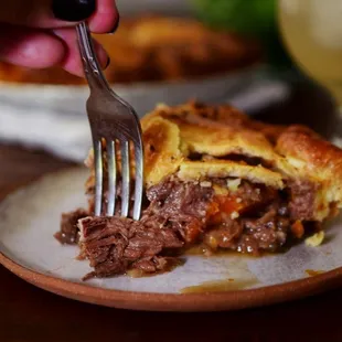 a person eating a piece of pie