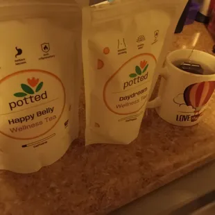 Happy Belly and Daydream loose-leaf teas along with mug