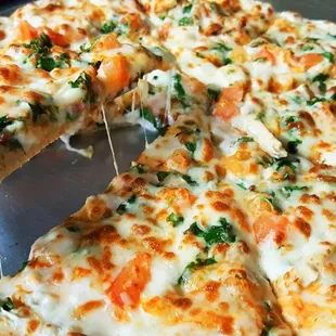 a sliced pizza on a pan