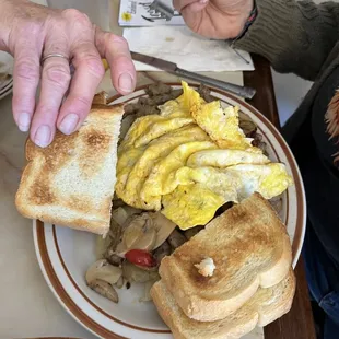 Breakfast skillet with scrambled eggs, sourdough toast