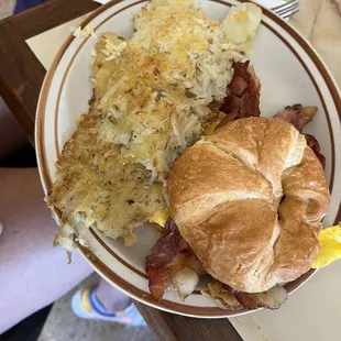 Breakfast croissant sandwich with Hashbrowns