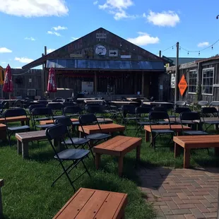 tables and benches in the grass
