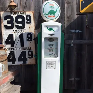 a gas pump and a sign