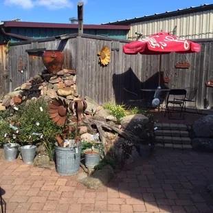 a patio area with a fire pit