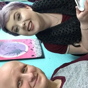 The place is decorated with finished pieces as well as canvas paintings they've done as classes