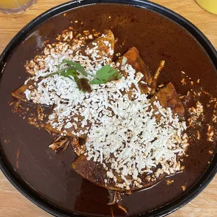 Enchiladas with mole with shredded chicken