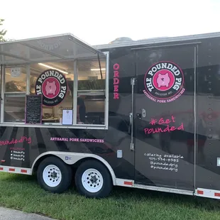 a food truck parked on the side of the road