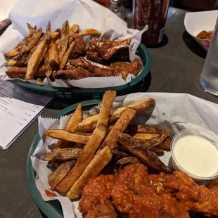 Hot Horseradish wings (foreground) and Thai Peanut wings (background).