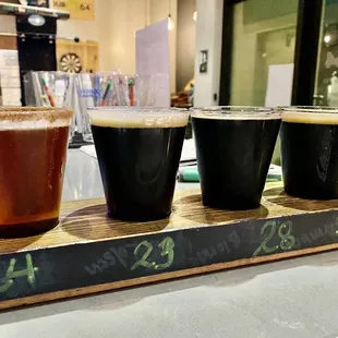 a flight of beers on a bar