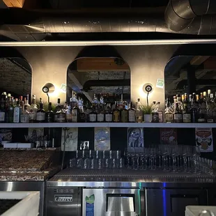 a bar with a lot of bottles