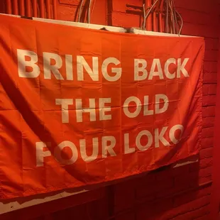 an orange banner hanging from the ceiling