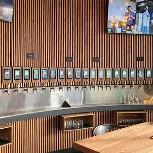 a row of beer taps