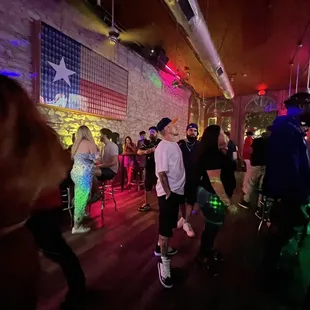 a group of people dancing at a party