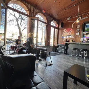 people sitting at tables in a restaurant