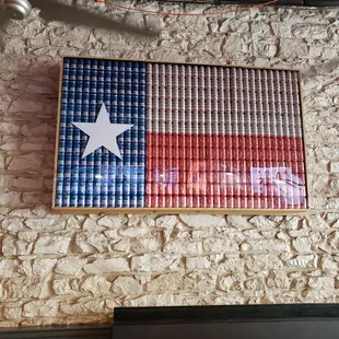 a texas flag made out of cans
