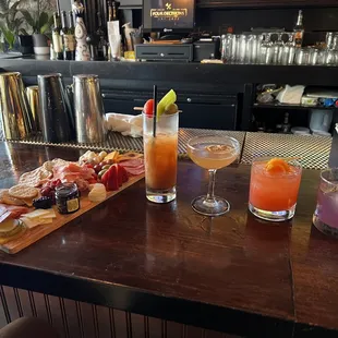 Our food and drink spread. The short orange drink is a summer margarita!