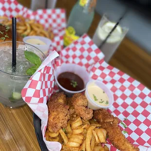 Omg these chicken tenders! Delicious batter!! Finger lickin goooooood!!! Alongside some curly fries!