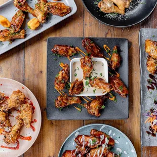 a selection of fried wings and dips