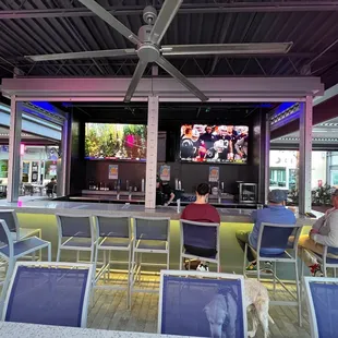 people sitting in chairs watching tv