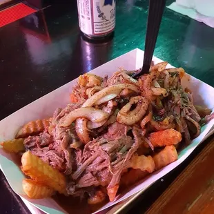 Debris Fries with grilled onions