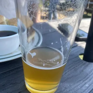 a glass of beer on a table