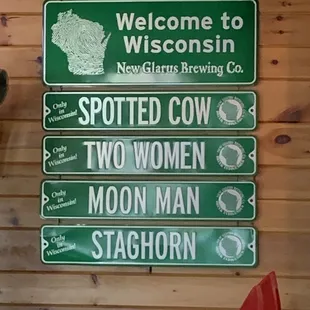 a variety of signs on a wall