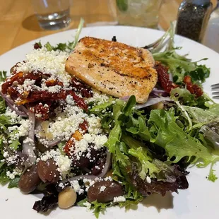 added salmon to provencale salad. olives, onions, beans, sun dried tomatoes, parmesan, cabbage, healthy greens