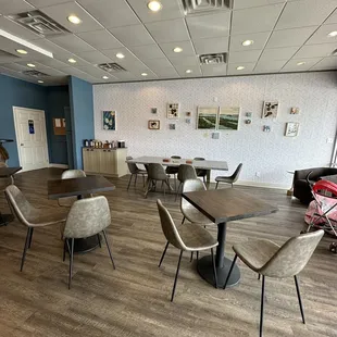 tables and chairs in a coffee shop