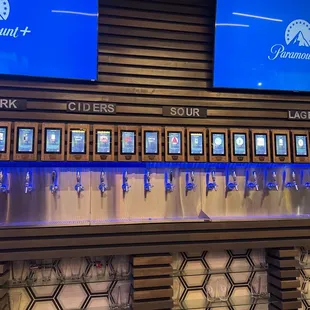 a row of beer taps