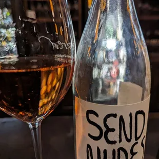 a bottle of wine and a glass of wine