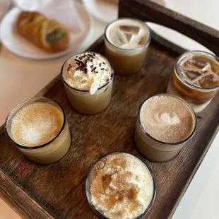 a tray of coffees and pastries