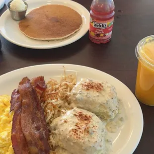 Biscuits and gravy w/bacon, eggs and hash browns, a single pancake, 16oz orange juice and a small bottle of Welch&apos;s fruit punch juice.