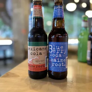 two bottles of beer on a table